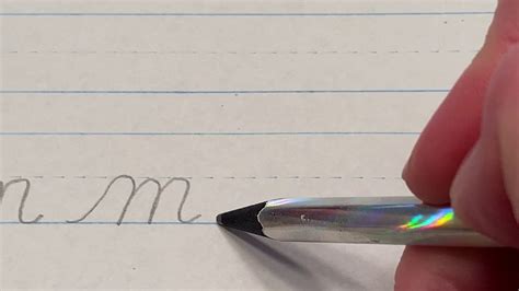 what does a cursive m look like and how does it reflect the evolution of handwriting?